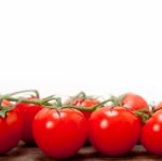 Fresh Cherry Tomatoes On A Cluster Stock Photo