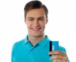 Smiling Man Holding Credit Card Stock Photo