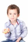 Boy Eating A Donut Stock Photo