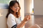 Portrait Of Beautiful Young And Teen Woman Looking To Mobile Pho Stock Photo