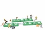 Miniature Worker Team Building Word Happy New Year On White Background Stock Photo