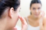 Body Care. Woman Applying Cream On Face Stock Photo