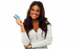 Young Woman Holding Up A Credit Card Stock Photo