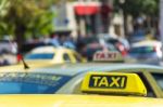 Yellow Taxi Sign On Cab Vehicle Roof Stock Photo