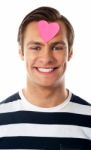 Male With Paper Heart On Forehead Stock Photo