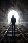 Man In A Tunnel Looking Towards The Light Stock Photo