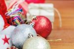 Balls And Gift On Wooden Stock Photo