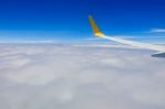 Clouds And Sky As Seen Through Window Of Aircraft Stock Photo