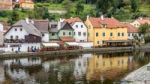 Colourful Buildings Along The Vlatava River In Krumlov Stock Photo