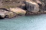 Rocks And Blue Water Near The Niagara Falls Stock Photo