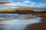 Sunset At Dunstanburgh Castle Stock Photo