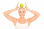 Woman Balancing Apple Stock Photo