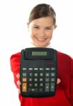 Smiling School Girl Showing Digital Calculator Stock Photo