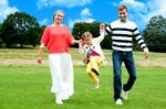 Young girl jumping in outdoors Stock Photo