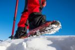 View Of Walking On Snow With Snow Shoes And Shoe Spikes In Winte Stock Photo