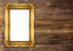 Old Gold Picture Frame On Wooden Background Stock Photo