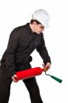 Handyman Wearing Uniform And Hardhat Stock Photo