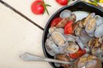 Fresh Clams On An Iron Skillet Stock Photo