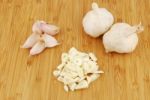 Garlic Preparation Ways On A Cutting Board Stock Photo