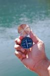 Hand Holding The Black Compass Stock Photo