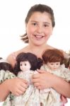 Little Girl With Dolls Stock Photo