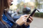 Beautiful Young Woman Using Her Mobile Phone In The Street Stock Photo