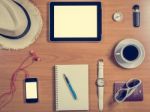 Office Desk With Tablet, Supplies, Coffee Cup And Personal Items Stock Photo