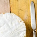 Camembert Cheese And Vintage Knife On Wooden Table Stock Photo