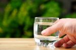 Holding Glass Of Water Stock Photo