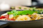 Spaghetti Pasta With Baked Cherry Tomatoes And Basil Stock Photo