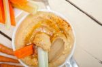 Fresh Hummus Dip With Raw Carrot And Celery Stock Photo