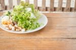 Homemade Salad Serving On Wooden Background Stock Photo