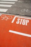 Orange Bicycle Lane With A Stop Sign Stock Photo