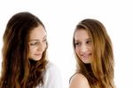 Portrait Of Girls Looking To Each Other Stock Photo