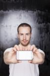 Young Male Showing Smartphone Stock Photo