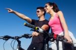 Happy Young  Couple On A Bike Ride In The Countryside Stock Photo