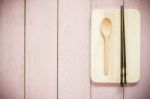 Vintage Wooden Chopsticks And Spoon On Pink Wooden Background Stock Photo