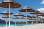 Parasols At Liscia Ruja Beach In Sardinia Stock Photo