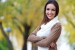 Beautiful Girl Looking At Camera In Autumn Stock Photo