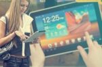 Young Woman With Tablet Computer Walking On Street Stock Photo