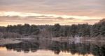 Cloudy Autumn Dawn. First Snow On The Autumn River. Spruce Trees Stock Photo