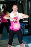 Smiling Fit Woman Lifting Kettlebell Stock Photo