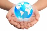 Hand Holding Crystal Globe Stock Photo