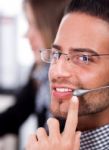 Business Man Speaking Through Head Phone Stock Photo