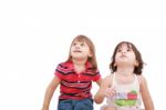 Two Little Girls Looking Up Stock Photo