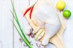 Culinary Background With Spices And Chicken Drumstick On Wooden Stock Photo