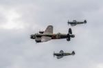 Avro Lancaster Flanked By Two Spitfires Stock Photo