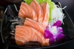 Sliced Salmon Sashimi Served On Black Plate Stock Photo