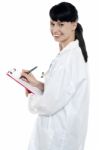 Nurse Writing Fresh Prescription For The Patient Stock Photo