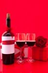 St Valentine's Setting With Present And Red Wine Stock Photo